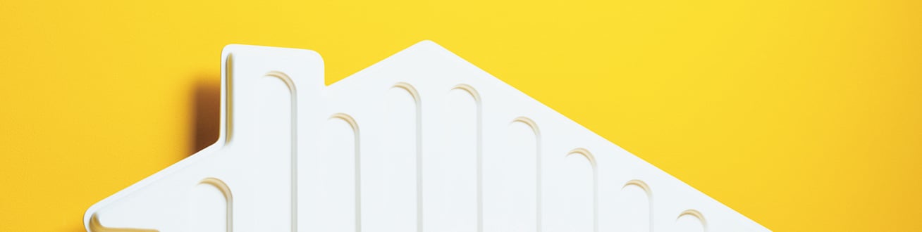 Ett vitt element som är format som ett hus. 